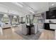 Bright and spacious living area with modern furniture, natural light, open floor plan, and dark wood cabinets at 1815 Avery Way, Castle Rock, CO 80109
