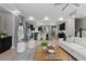 Bright living room with hardwood flooring, modern decor and open floor plan to kitchen at 1815 Avery Way, Castle Rock, CO 80109