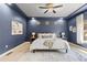 Inviting main bedroom featuring neutral walls, soft lighting, carpet flooring, and a comfortable bed at 1815 Avery Way, Castle Rock, CO 80109