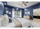 Spacious main bedroom featuring tray ceilings, ensuite bathroom, and large window at 1815 Avery Way, Castle Rock, CO 80109