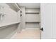 Spacious walk-in closet featuring custom shelving and ample storage space at 1815 Avery Way, Castle Rock, CO 80109