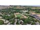 Expansive aerial view featuring townhomes, schools, athletic fields, and mountain views at 1006 Homestake Dr # 1D, Golden, CO 80401