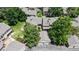 An aerial view of well-maintained townhomes with mature trees in a serene, landscaped setting at 1006 Homestake Dr # 1D, Golden, CO 80401