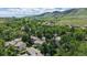 Stunning aerial shot of townhomes surrounded by green spaces, with scenic mountain views at 1006 Homestake Dr # 1D, Golden, CO 80401
