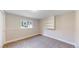 Basement bedroom features a window and built in shelving at 1006 Homestake Dr # 1D, Golden, CO 80401