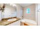 Updated bathroom featuring granite counters, shower-tub and neutral tile surround at 1006 Homestake Dr # 1D, Golden, CO 80401