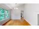 Dining room with a chandelier, hardwood floors and access to the kitchen at 1006 Homestake Dr # 1D, Golden, CO 80401