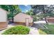 Detached garage featuring brick accents and convenient side entrance at 1006 Homestake Dr # 1D, Golden, CO 80401