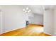 Open-concept living area with hardwood floors, modern fireplace and a large window at 1006 Homestake Dr # 1D, Golden, CO 80401