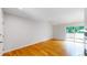Bright living room featuring hardwood floors and access to a private balcony at 1006 Homestake Dr # 1D, Golden, CO 80401