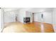 Bright living room featuring hardwood floors, a fireplace and an entry door at 1006 Homestake Dr # 1D, Golden, CO 80401