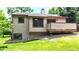 This home has a charming rear exterior with a deck and well-maintained landscaping at 1006 Homestake Dr # 1D, Golden, CO 80401