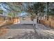 Backyard view with rock garden, wood fence, and wood pergola over patio at 1362 Wolff St, Denver, CO 80204