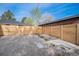 View of a fenced backyard with gravel at 1362 Wolff St, Denver, CO 80204
