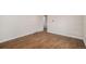 Bedroom featuring hardwood floors, a large window, and ample space at 1362 Wolff St, Denver, CO 80204