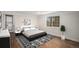 Comfortable bedroom with a large window for natural light and stylish decor accents at 1362 Wolff St, Denver, CO 80204