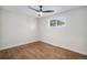 Bright bedroom with a modern ceiling fan, hardwood floors, and ample natural light at 1362 Wolff St, Denver, CO 80204