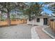 Charming home features a well-maintained front yard with beautiful landscaping, a quaint stone path, and privacy fencing at 1362 Wolff St, Denver, CO 80204