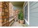 Charming balcony with stone accents, providing a cozy outdoor space with potted plants and seating at 457 Black Feather Loop # 702, Castle Rock, CO 80104