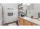 Bathroom featuring a wooden vanity, decorative elements, and a shower with a gray curtain at 457 Black Feather Loop # 702, Castle Rock, CO 80104