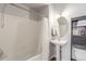 A traditional bathroom with a pedestal sink and a bathtub-shower combo at 457 Black Feather Loop # 702, Castle Rock, CO 80104