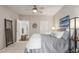 Bedroom with ensuite bathroom, ceiling fan, and hardwood floors at 457 Black Feather Loop # 702, Castle Rock, CO 80104