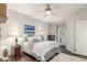 Bright bedroom with a ceiling fan, artwork, and lots of natural light at 457 Black Feather Loop # 702, Castle Rock, CO 80104