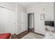 Bright bedroom with white walls, wood floor and sliding closet doors at 457 Black Feather Loop # 702, Castle Rock, CO 80104