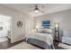 Cozy bedroom with a ceiling fan, accent lighting, and an ensuite bathroom at 457 Black Feather Loop # 702, Castle Rock, CO 80104