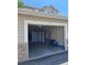 Exterior view of the garage with a single door and brick accents at 457 Black Feather Loop # 702, Castle Rock, CO 80104
