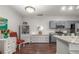 Open kitchen with grey cabinets, stainless steel appliances, and hardwood floors at 457 Black Feather Loop # 702, Castle Rock, CO 80104