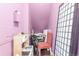 A small, cozy room with pink walls, toys, a play kitchen, and a chair at 457 Black Feather Loop # 702, Castle Rock, CO 80104