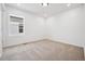A well lit bedroom with neutral carpet and a window at 2102 Wagon Wheel Aly, Brighton, CO 80601