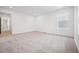 Spacious bedroom with plush carpeting, bright natural light, and neutral paint colors at 2102 Wagon Wheel Aly, Brighton, CO 80601