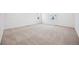 A bright, carpeted bedroom with a window at 2102 Wagon Wheel Aly, Brighton, CO 80601