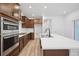 Modern kitchen features stainless steel appliances, a gas cooktop, and a large island at 2102 Wagon Wheel Aly, Brighton, CO 80601