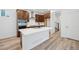 Modern kitchen featuring a large island, stainless steel appliances, and wooden cabinets at 2102 Wagon Wheel Aly, Brighton, CO 80601