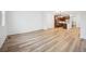 Bright, open-concept living space featuring wood-look floors and a view into the modern kitchen at 2102 Wagon Wheel Aly, Brighton, CO 80601