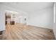 Spacious living room featuring wood floors, an open layout, and a dining area at 2102 Wagon Wheel Aly, Brighton, CO 80601