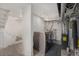 Basement laundry area with modern washer and dryer, next to a staircase at 2272 Jay St, Edgewater, CO 80214