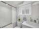 Cozy bathroom featuring updated fixtures, tiled shower, and ample counter space at 2272 Jay St, Edgewater, CO 80214