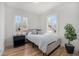 Bright bedroom with wood floors, a large window, and neutral decor for a tranquil space at 2272 Jay St, Edgewater, CO 80214