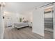 Basement bedroom with wood-look floors, a closet, and a soothing color scheme at 2272 Jay St, Edgewater, CO 80214