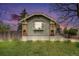 Home with brick details and updated landscaping featuring uplighting in the front yard at 2272 Jay St, Edgewater, CO 80214