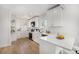 Modern kitchen with white cabinetry, new countertops, and stainless steel appliances at 2272 Jay St, Edgewater, CO 80214