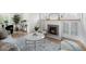 Cozy living room features a decorative fireplace and refinished hardwood floors at 2272 Jay St, Edgewater, CO 80214