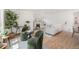 Bright living room with refinished hardwood floors and an open floor plan at 2272 Jay St, Edgewater, CO 80214