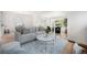 Bright living room with refinished hardwood floors and neutral color palette at 2272 Jay St, Edgewater, CO 80214