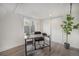 Home office space with a modern desk, ample natural light, and a closet for storage at 2272 Jay St, Edgewater, CO 80214