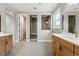 Bright bathroom featuring double vanities, a walk-in shower, and modern fixtures at 3370 Backdrop Ct, Castle Rock, CO 80108